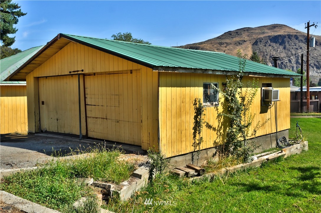 628 Twisp Carlton Road Twisp, WA 98856 - Photo 24 of 32 a view of a house with backyard and entertaining space