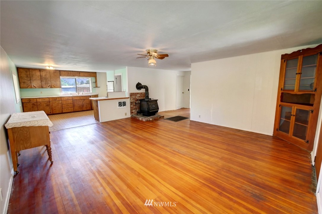 628 Twisp Carlton Road Twisp, WA 98856 - Photo 7 of 32 a living room with furniture and a wooden floor