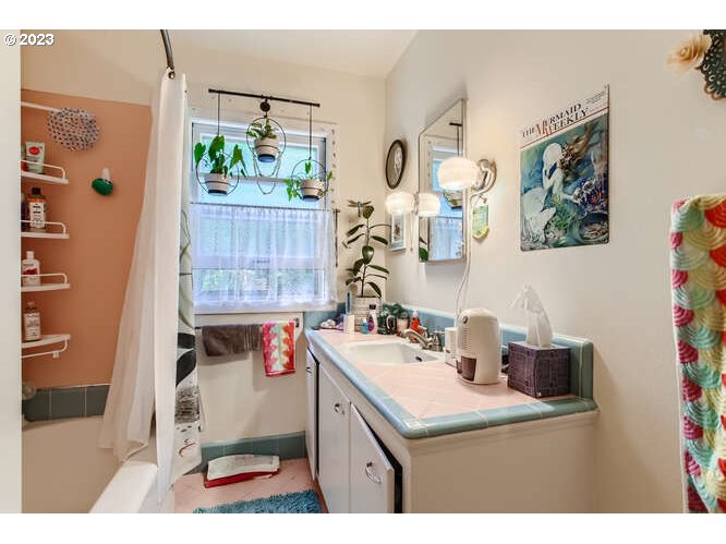 11 Northeast 62nd Avenue Portland, OR 97213 - Photo 23 of 28 a utility room with a window dryer and washer