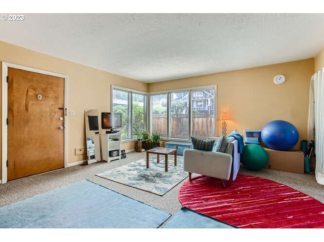 11 Northeast 62nd Avenue Portland, OR 97213 - Photo 7 of 28 a living room with furniture and a large window