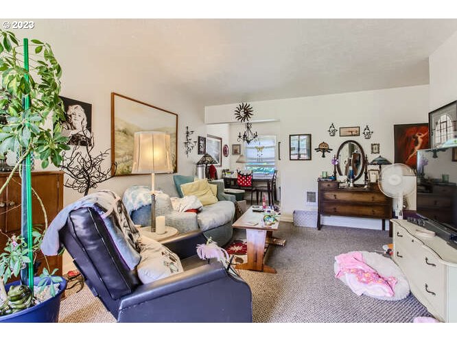 11 Northeast 62nd Avenue Portland, OR 97213 - Photo 10 of 28 a living room with furniture and flowers