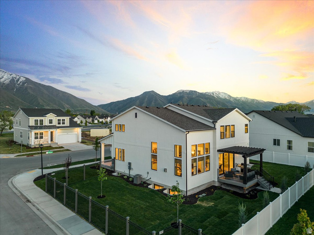 2458 West Aurora Avenue, Unit 287 Mapleton, UT 84664 - Photo 24 of 24 Back of property with a fenced backyard, a pergola, stucco siding, and a deck with mountain view