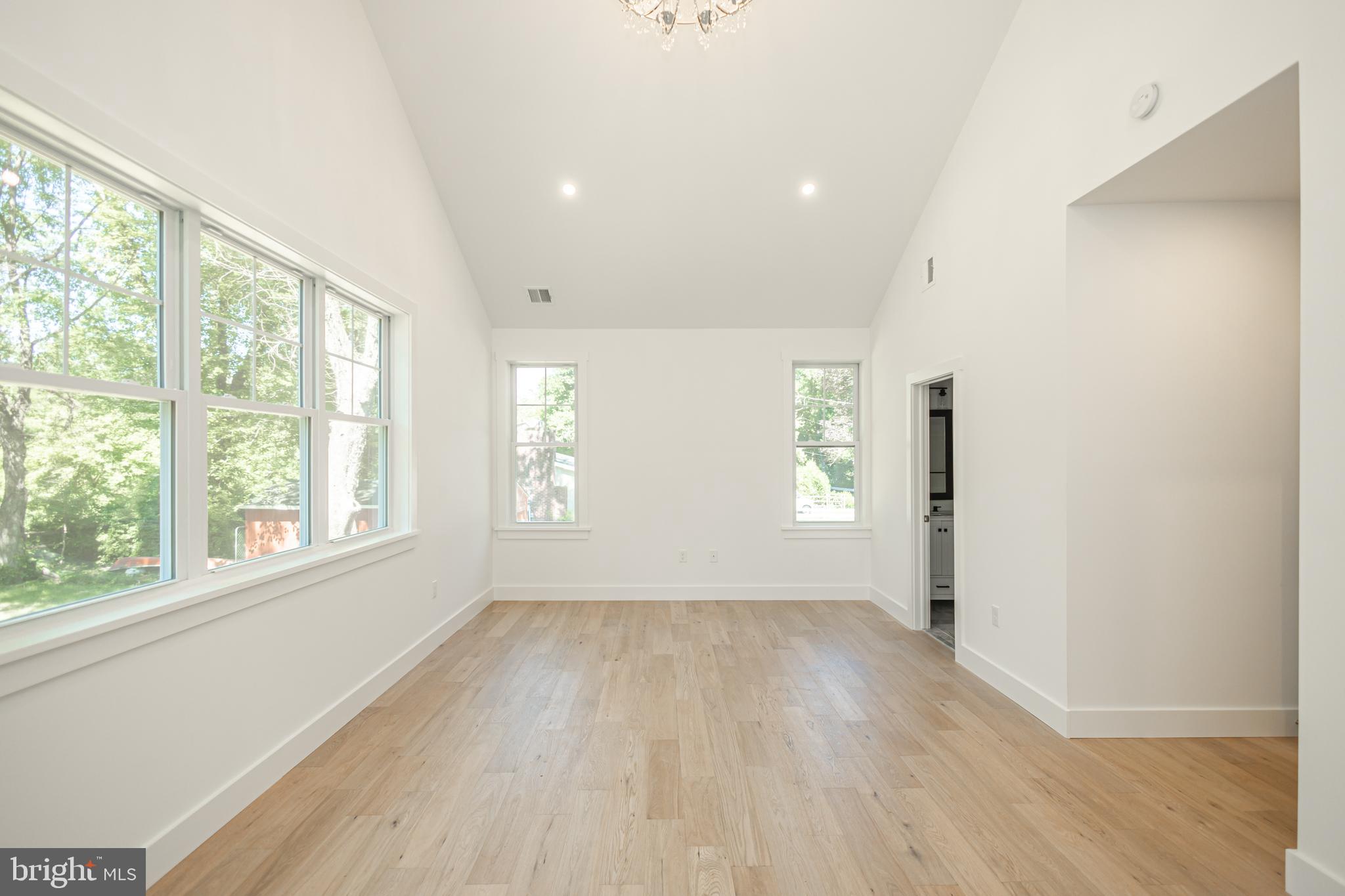 1764 River Road Upper Black Eddy, PA 18972 - Photo 18 of 37 an empty room with wooden floor and windows