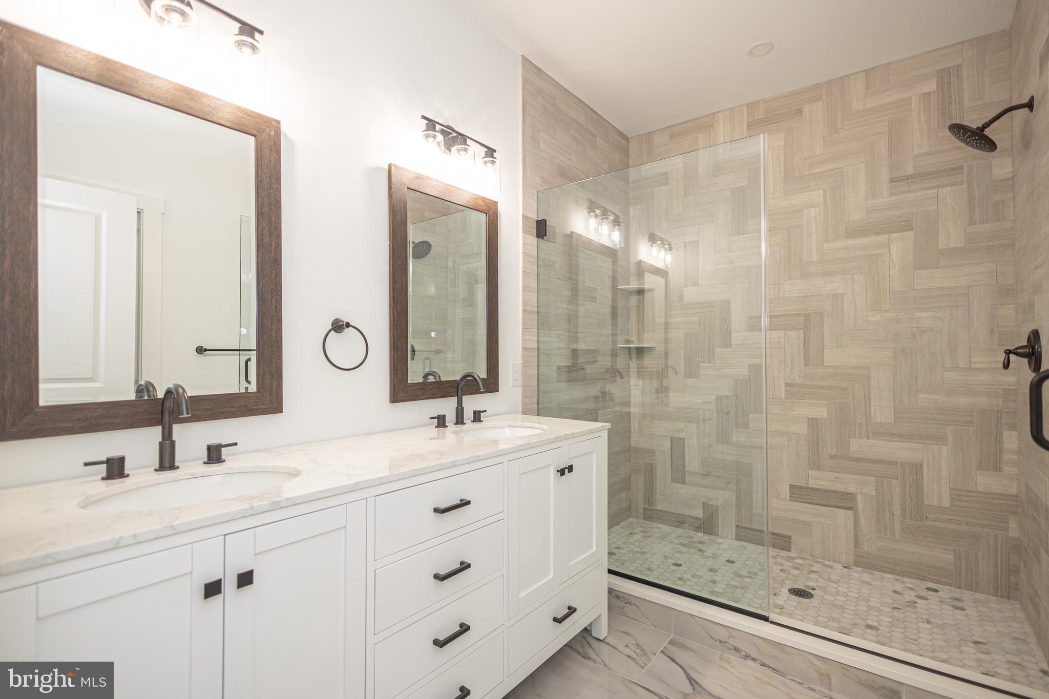 1764 River Road Upper Black Eddy, PA 18972 - Photo 19 of 37 a bathroom with a shower sink and mirror
