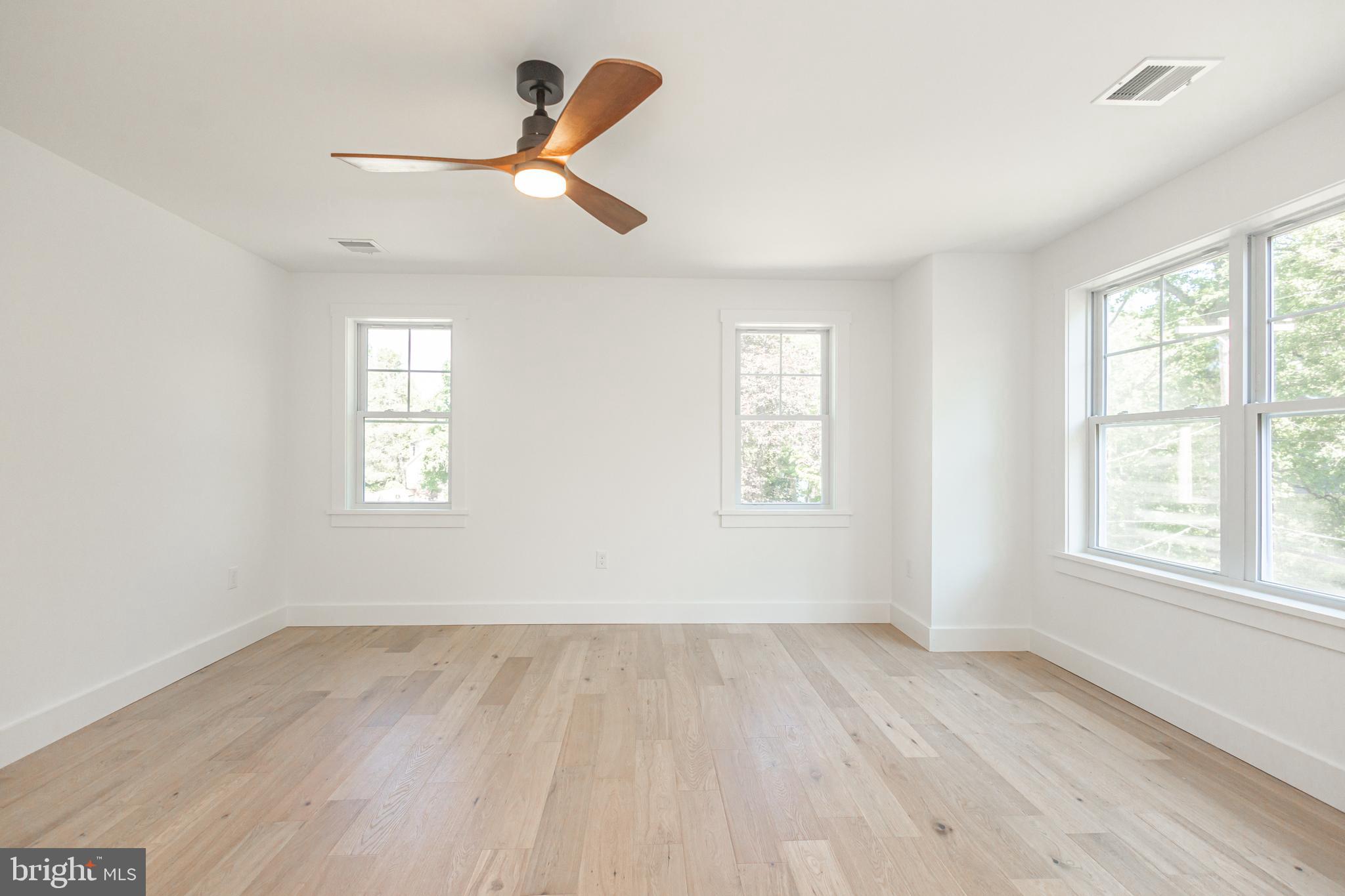 1764 River Road Upper Black Eddy, PA 18972 - Photo 23 of 37 a view of empty room with wooden floor and fan