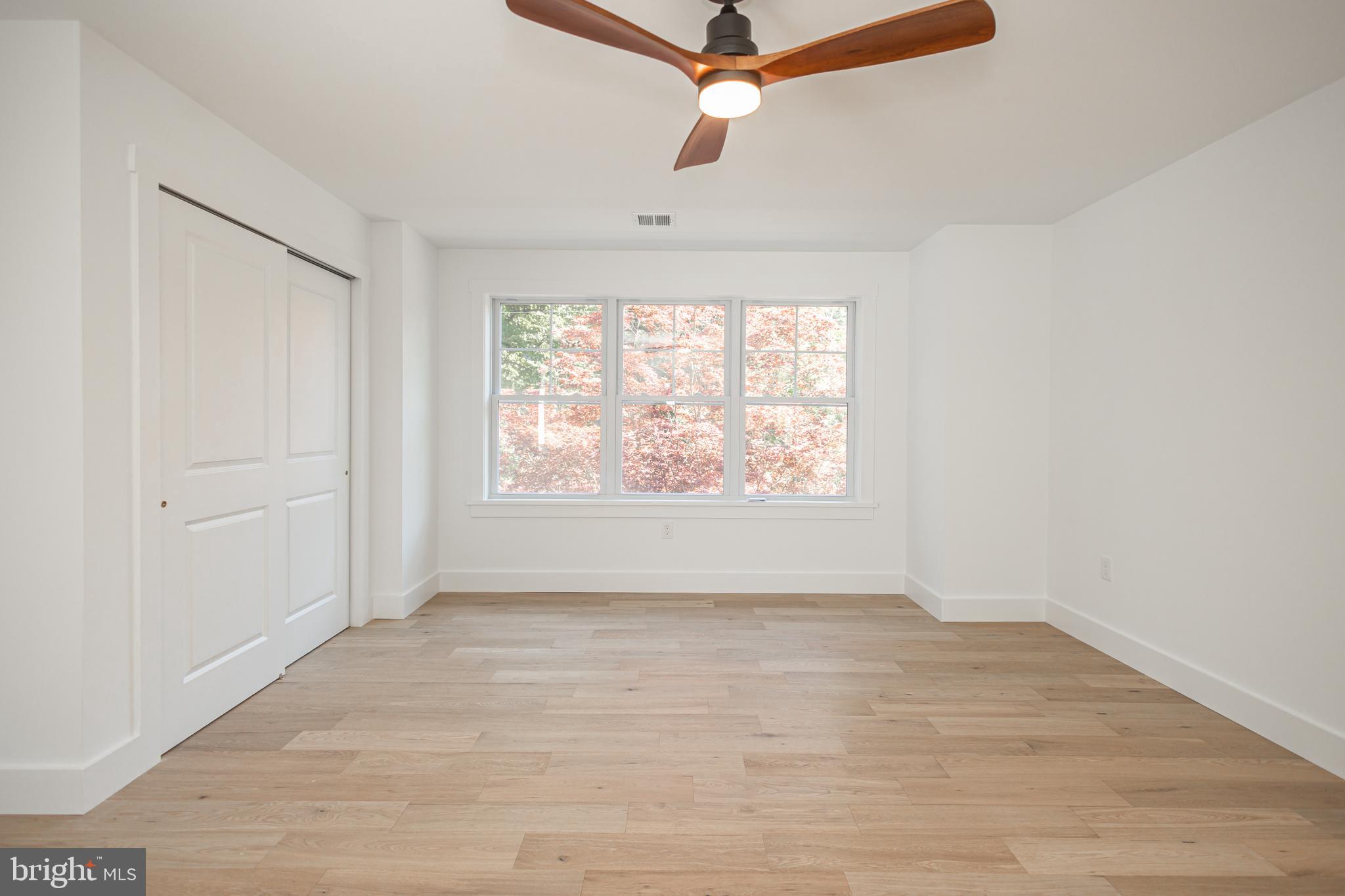 1764 River Road Upper Black Eddy, PA 18972 - Photo 26 of 37 wooden floor in an empty room with a window