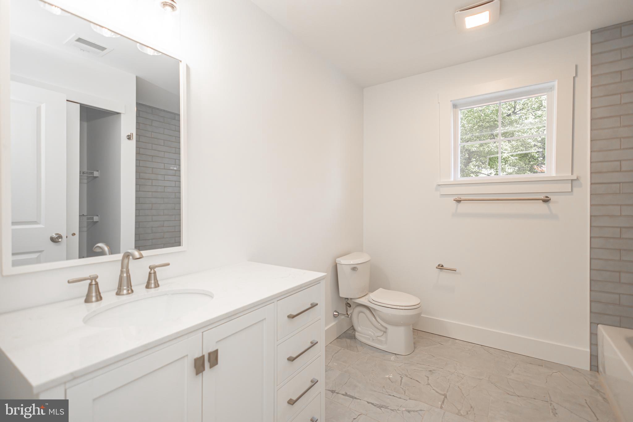 1764 River Road Upper Black Eddy, PA 18972 - Photo 28 of 37 a bathroom with a sink toilet and a mirror