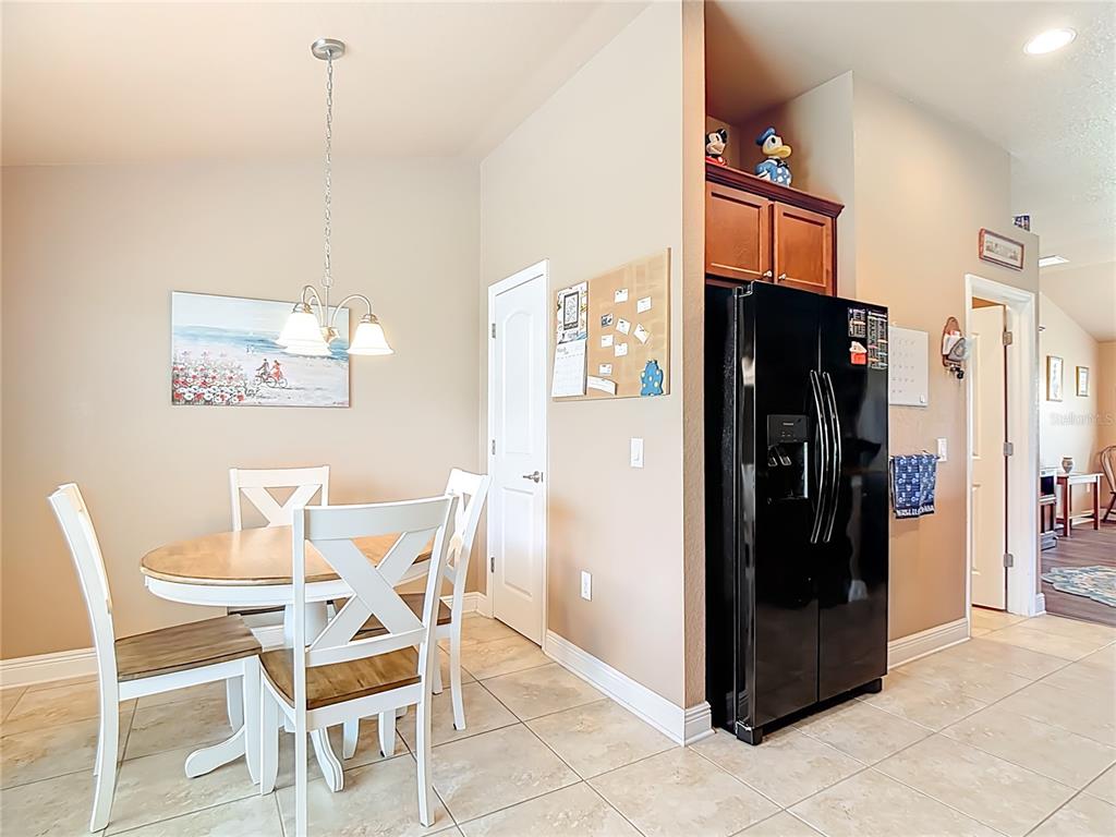 1170 Legatto Loop Dundee, FL 33838 - Photo 17 of 38 a view of a kitchen and dining room