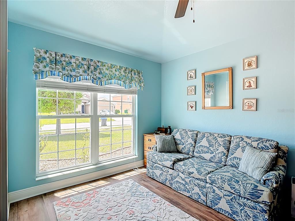 1170 Legatto Loop Dundee, FL 33838 - Photo 31 of 38 a living room with furniture and a window