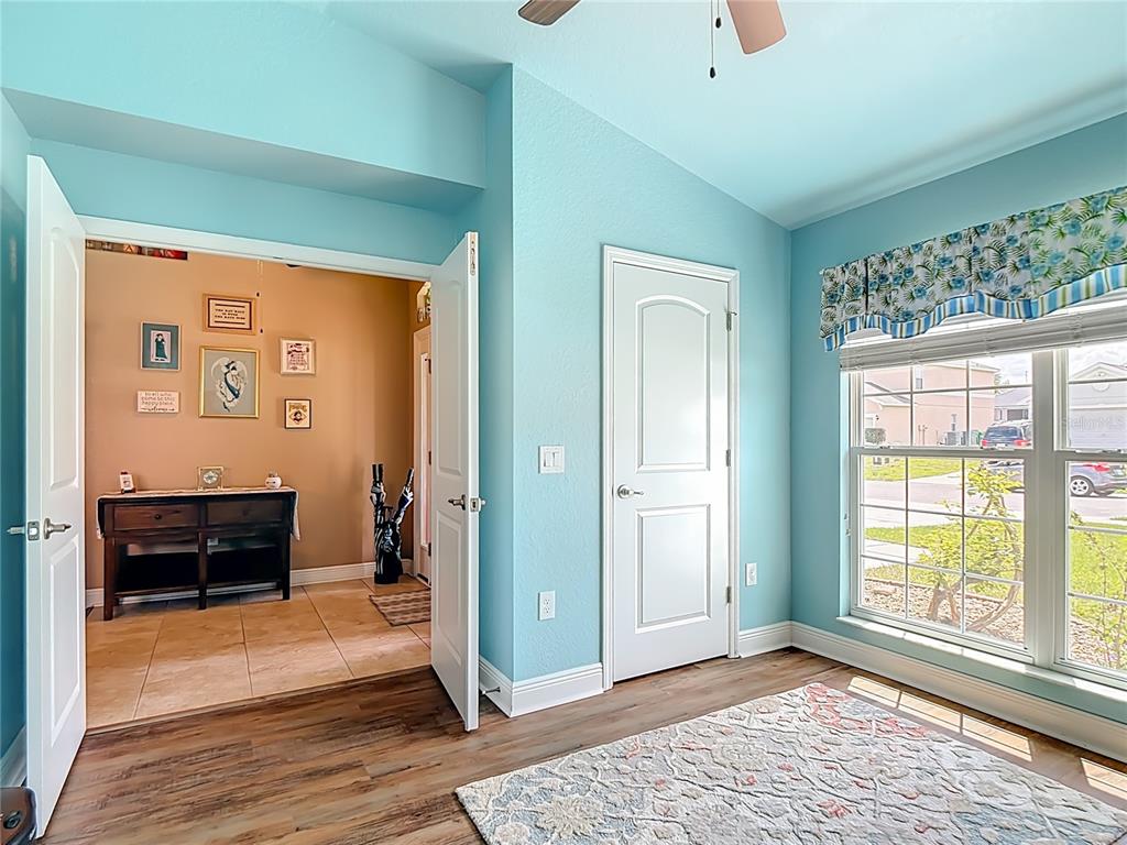 1170 Legatto Loop Dundee, FL 33838 - Photo 33 of 38 a view of a livingroom with wooden floor and furniture