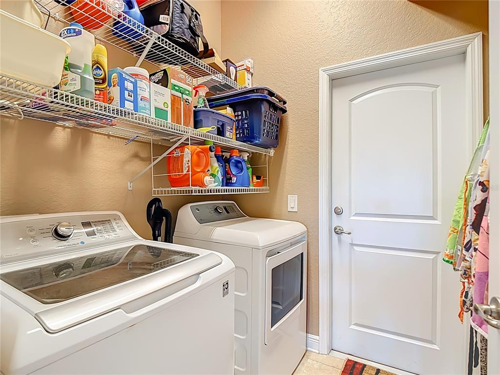 1170 Legatto Loop Dundee, FL 33838 - Photo 34 of 38 a utility room with dryer and washer
