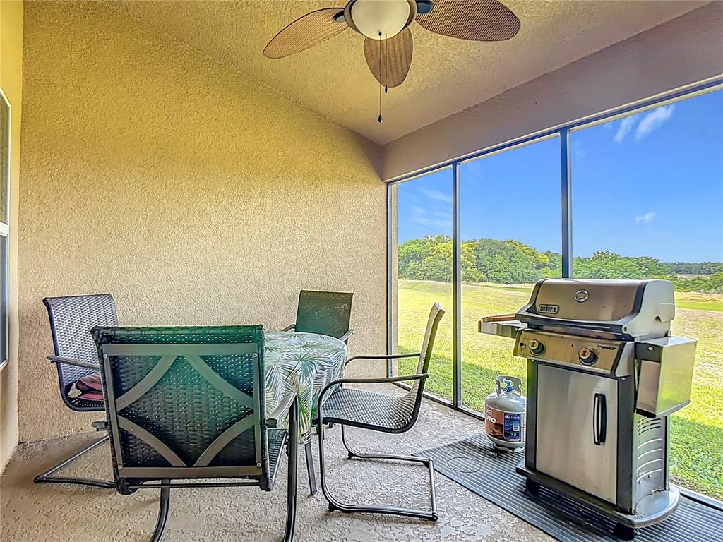 1170 Legatto Loop Dundee, FL 33838 - Photo 36 of 38 a work room with furniture and outdoor view
