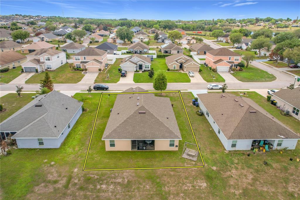 1170 Legatto Loop Dundee, FL 33838 - Photo 37 of 38 an aerial view of residential houses with outdoor space