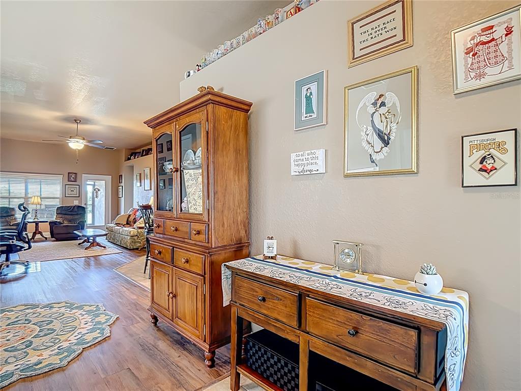 1170 Legatto Loop Dundee, FL 33838 - Photo 5 of 38 a view of living room and kitchen