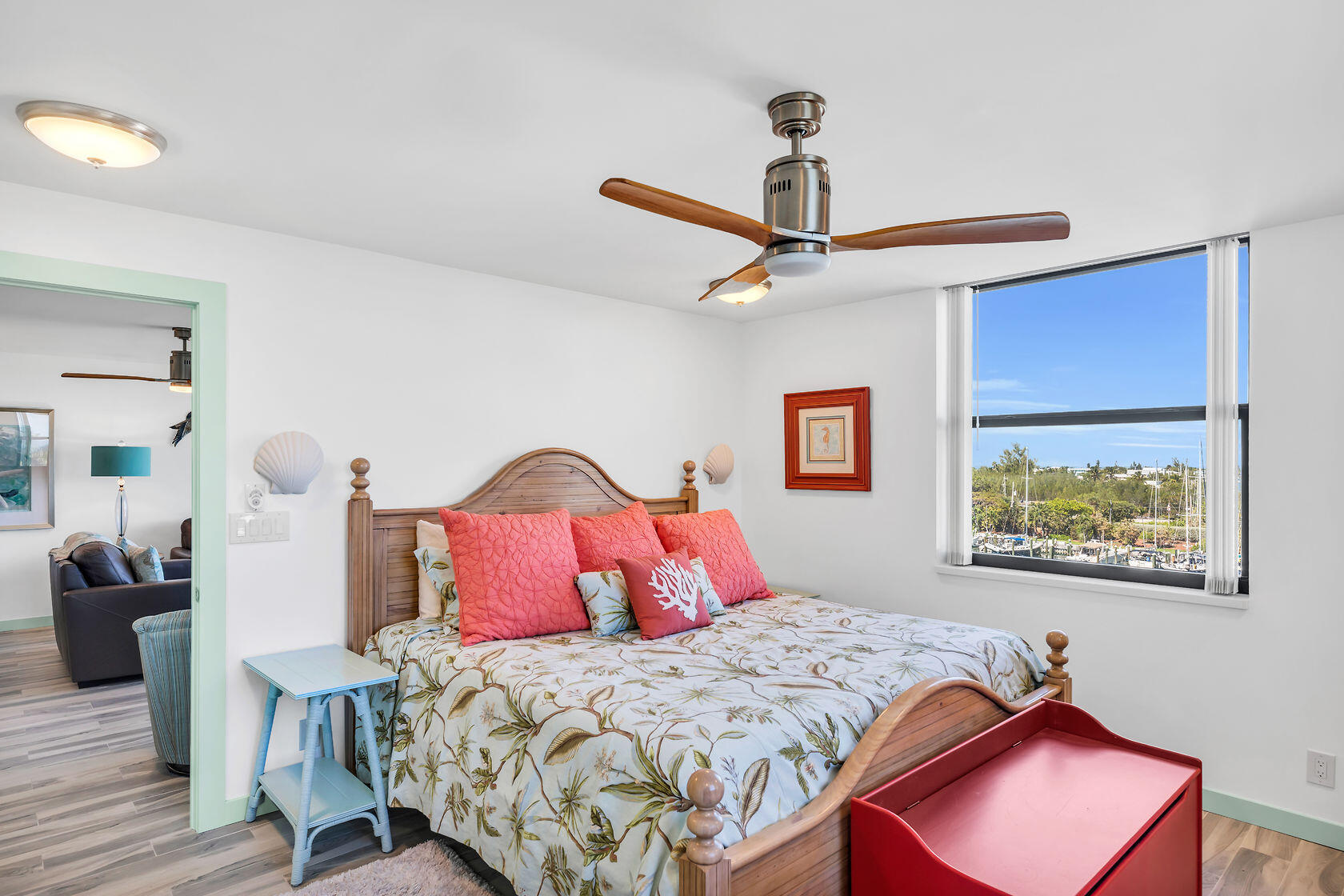 2000 Coco Plum Drive, Unit 503 Marathon, FL 33050 - Photo 14 of 37 a bedroom with a bed and a chandelier