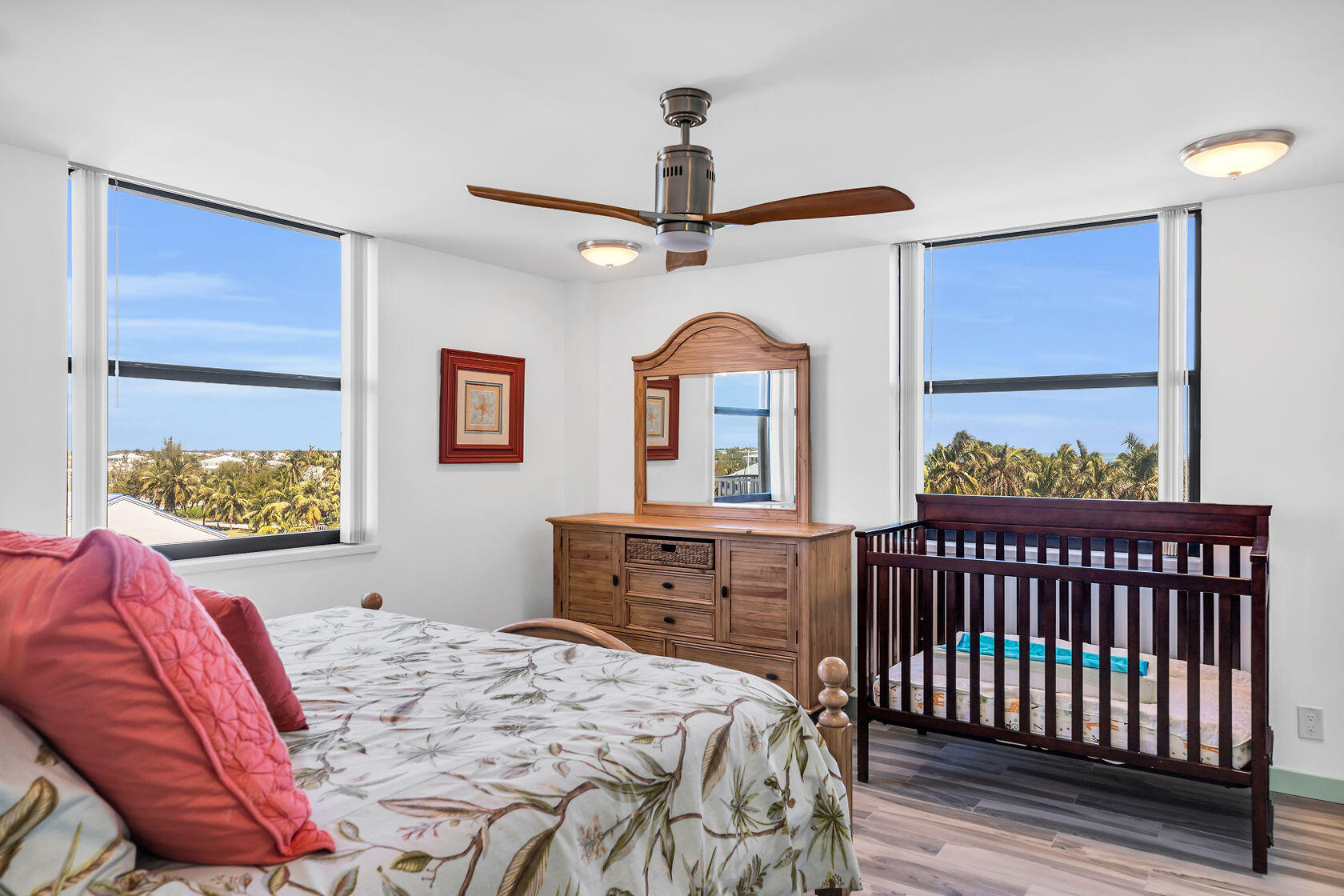 2000 Coco Plum Drive, Unit 503 Marathon, FL 33050 - Photo 15 of 37 a bedroom with a bed and a dresser