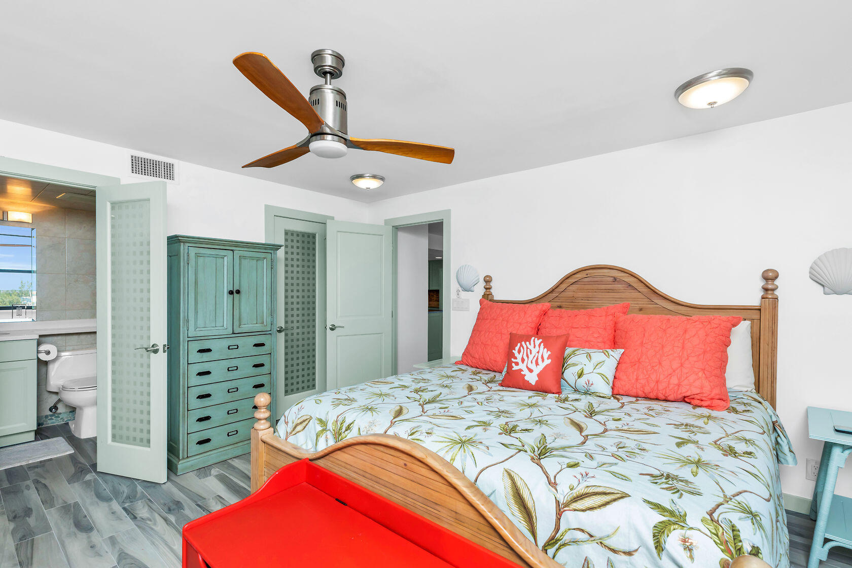 2000 Coco Plum Drive, Unit 503 Marathon, FL 33050 - Photo 16 of 37 a bedroom with a bed and a dresser