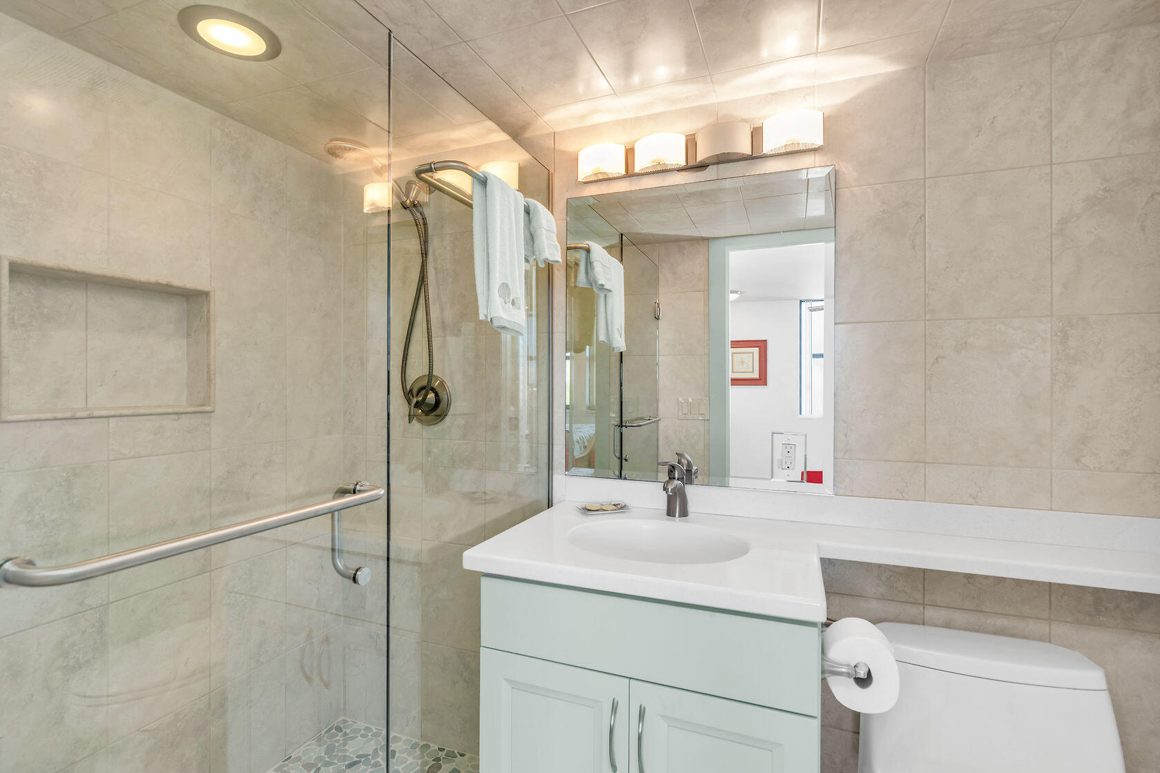 2000 Coco Plum Drive, Unit 503 Marathon, FL 33050 - Photo 18 of 37 a bathroom with a sink vanity and a mirror