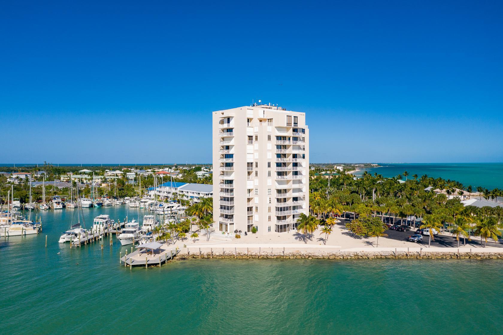 2000 Coco Plum Drive, Unit 503 Marathon, FL 33050 - Photo 30 of 37 a view of a city with tall buildings