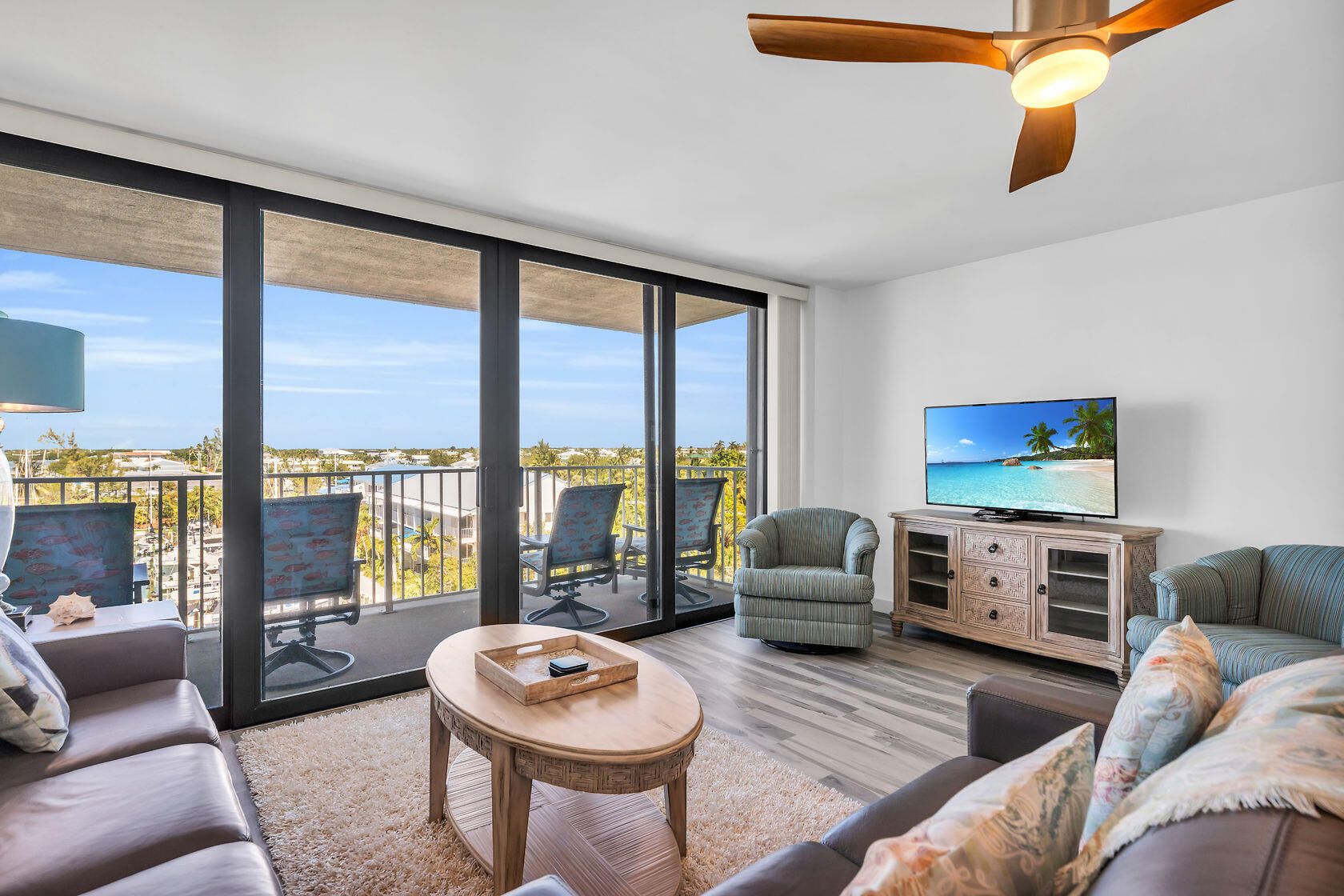 2000 Coco Plum Drive, Unit 503 Marathon, FL 33050 - Photo 5 of 37 a living room with furniture and a floor to ceiling window