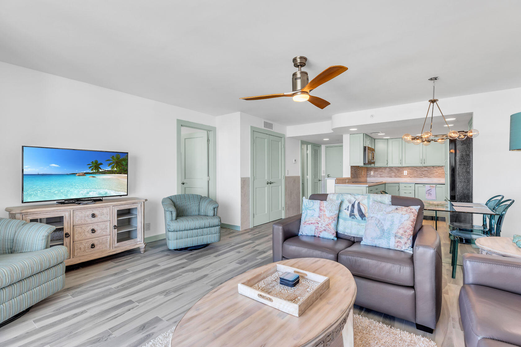 2000 Coco Plum Drive, Unit 503 Marathon, FL 33050 - Photo 9 of 37 a living room with furniture and a flat screen tv