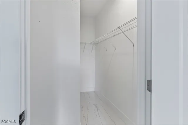 a view of an empty walk in closet