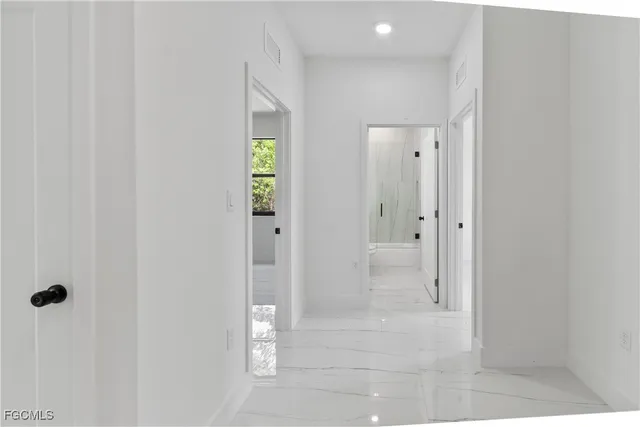 a front view of house with yard and garage