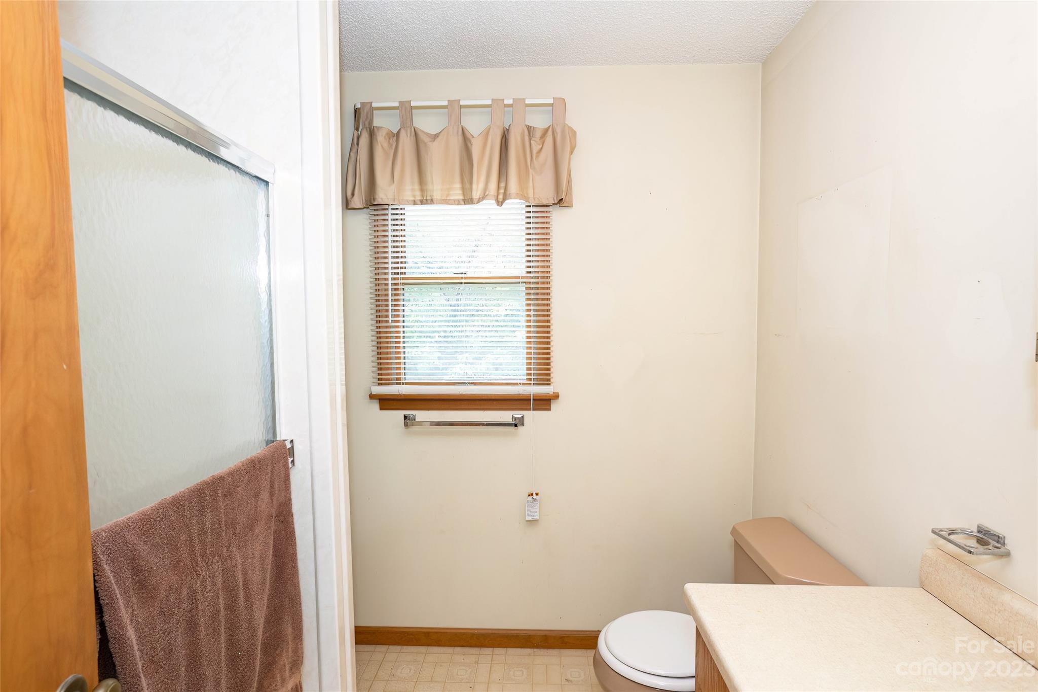 50 Morgan Branch Road Leicester, NC 28748 - Photo 17 of 41 a bathroom with a toilet sink and mirror