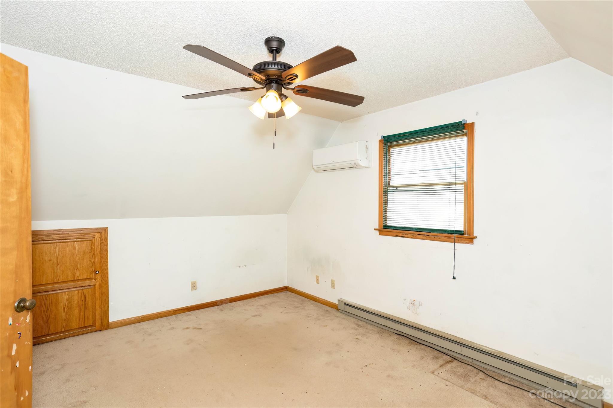 50 Morgan Branch Road Leicester, NC 28748 - Photo 21 of 41 an empty room with windows and fan