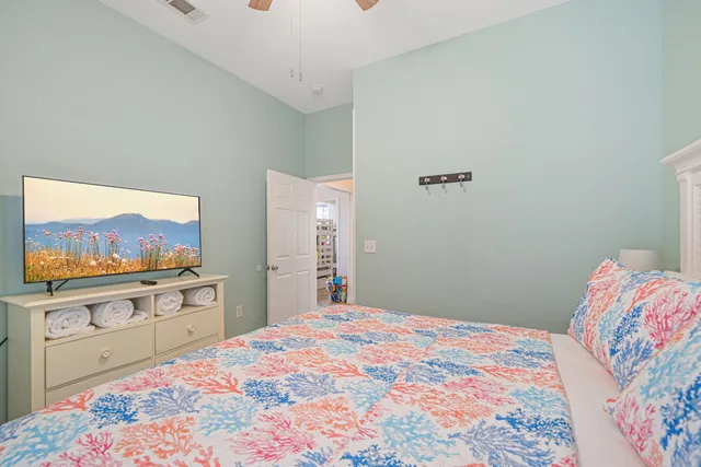 a view of a livingroom with furniture and a ceiling fan