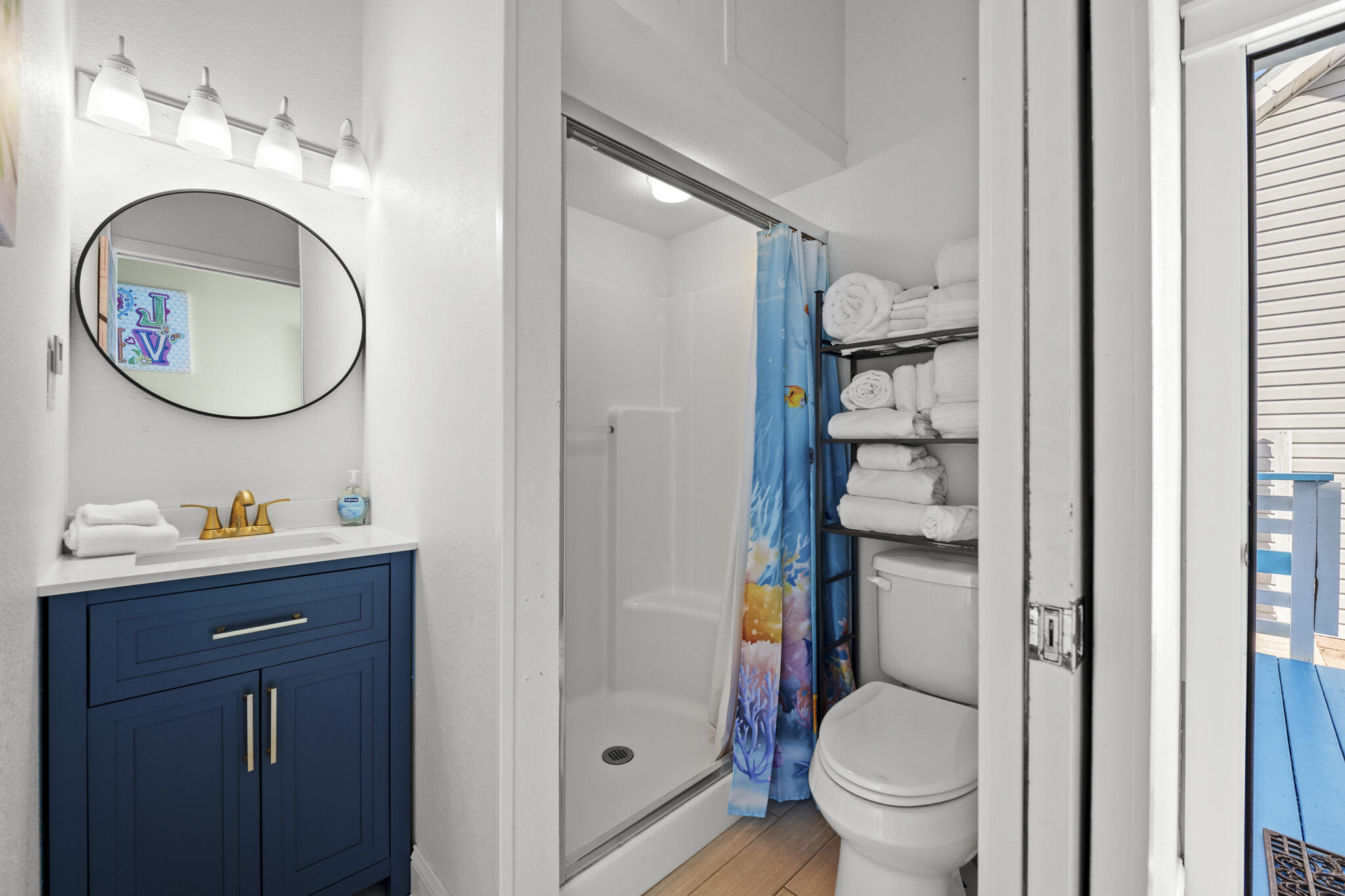 4431 Luke Avenue Destin, FL 32541 - Photo 34 of 100 a bathroom with a toilet sink and mirror