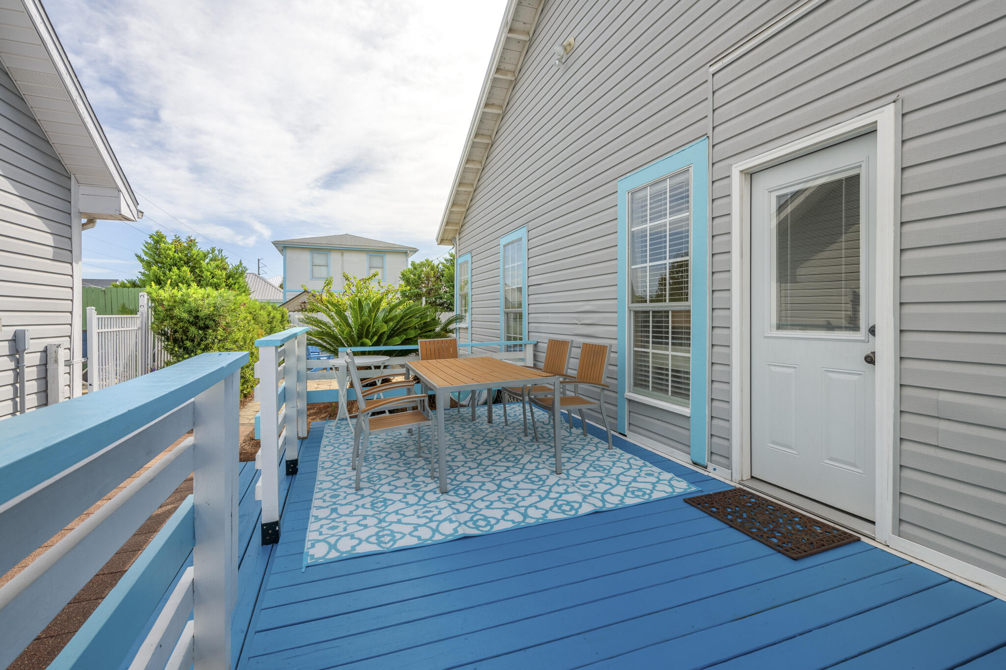 4431 Luke Avenue Destin, FL 32541 - Photo 50 of 100 a table and chairs in front of a house