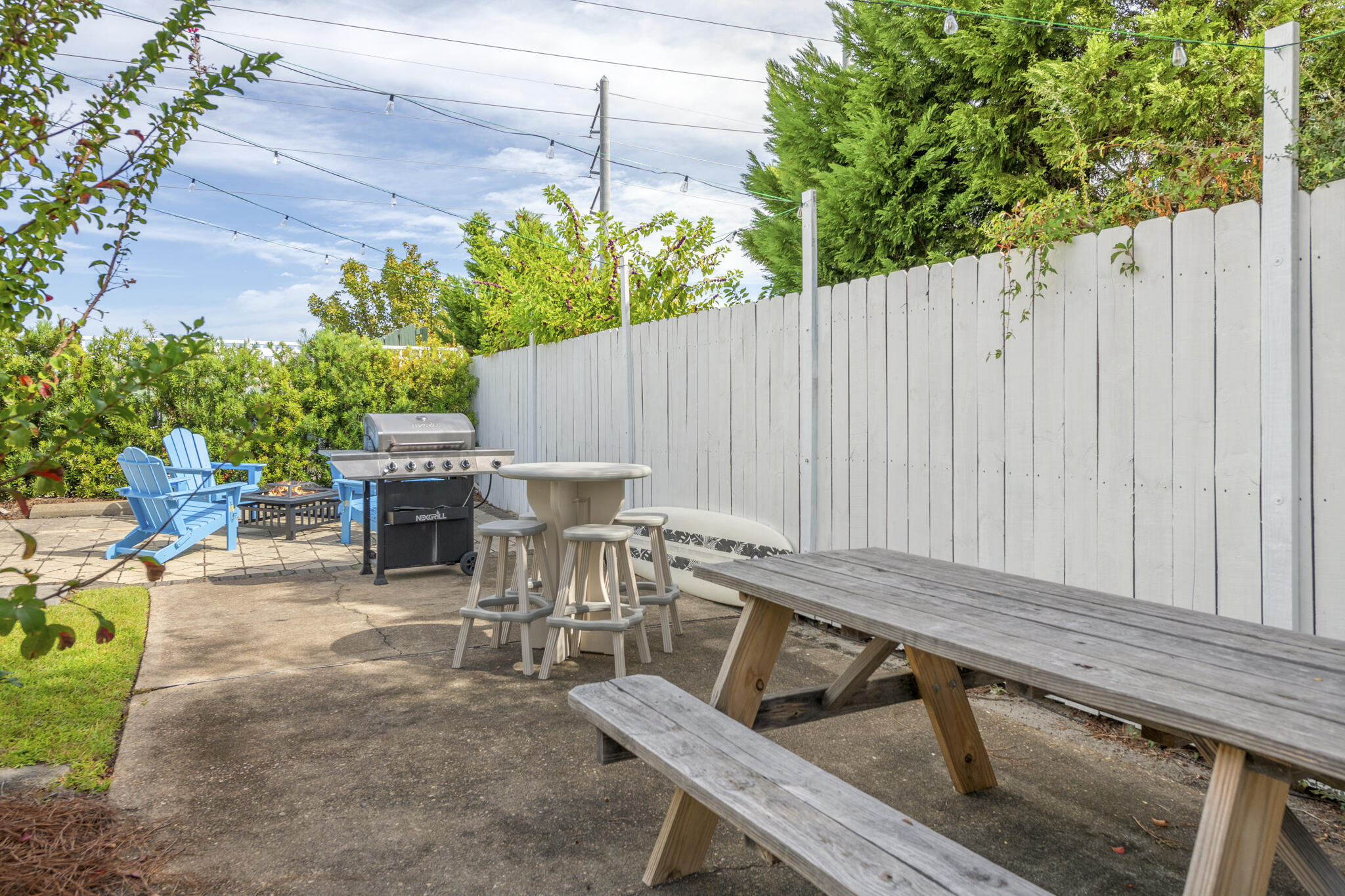 4431 Luke Avenue Destin, FL 32541 - Photo 68 of 100 a view of a backyard with chairs and a small cabin