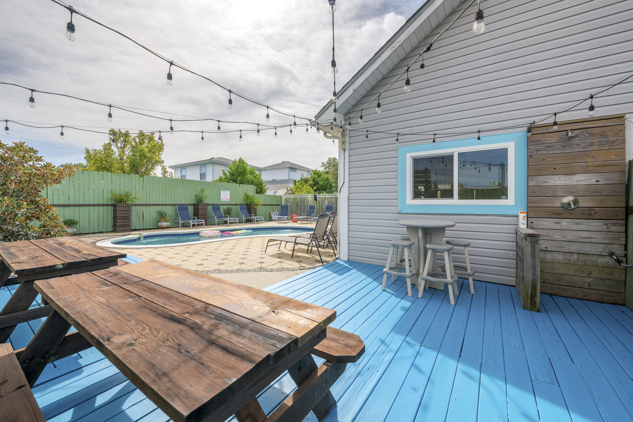 4431 Luke Avenue Destin, FL 32541 - Photo 71 of 100 a view of a patio with table and chairs with wooden floor