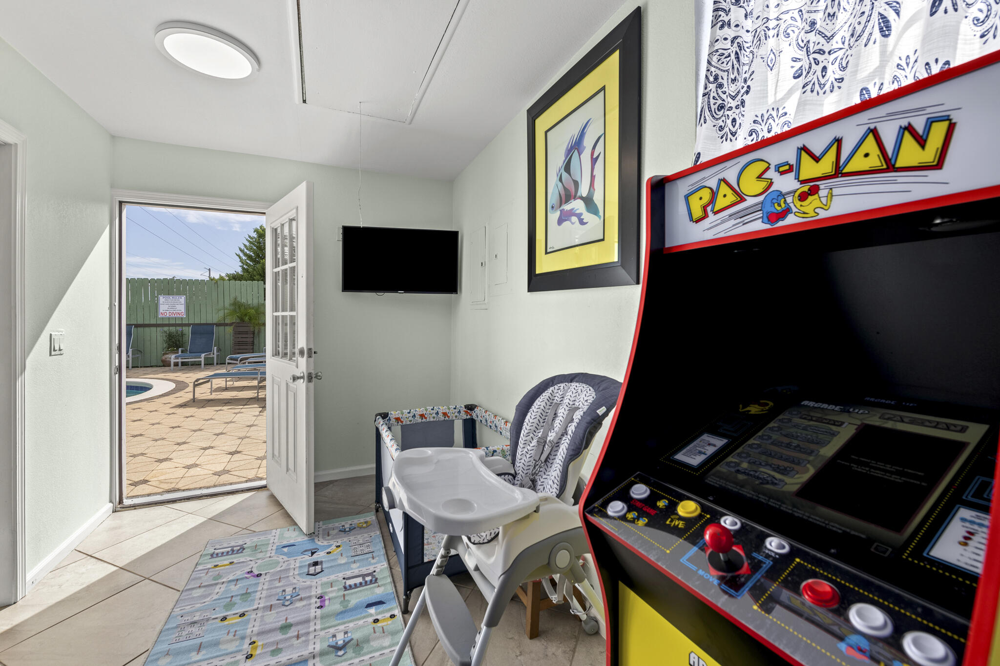 4431 Luke Avenue Destin, FL 32541 - Photo 100 of 100 a view of a workspace with furniture and a flat screen tv