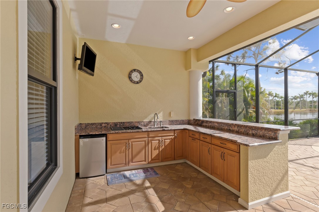 6057 Calusa Rdg Trail Bokeelia, FL 33922 - Photo 28 of 45 a view of a kitchen with a sink and cabinets
