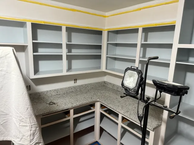 a view of a livingroom with furniture and closet