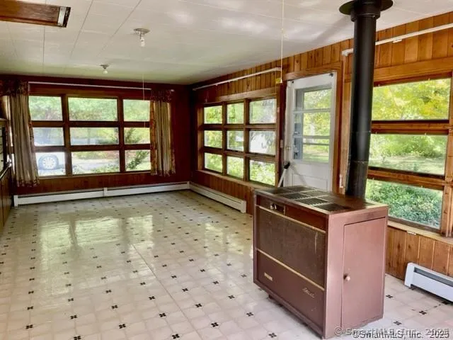 a kitchen with a stove a sink and a refrigerator