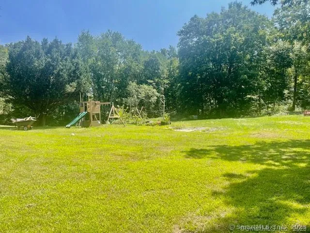 a view of a swimming pool with an outdoor space and seating area