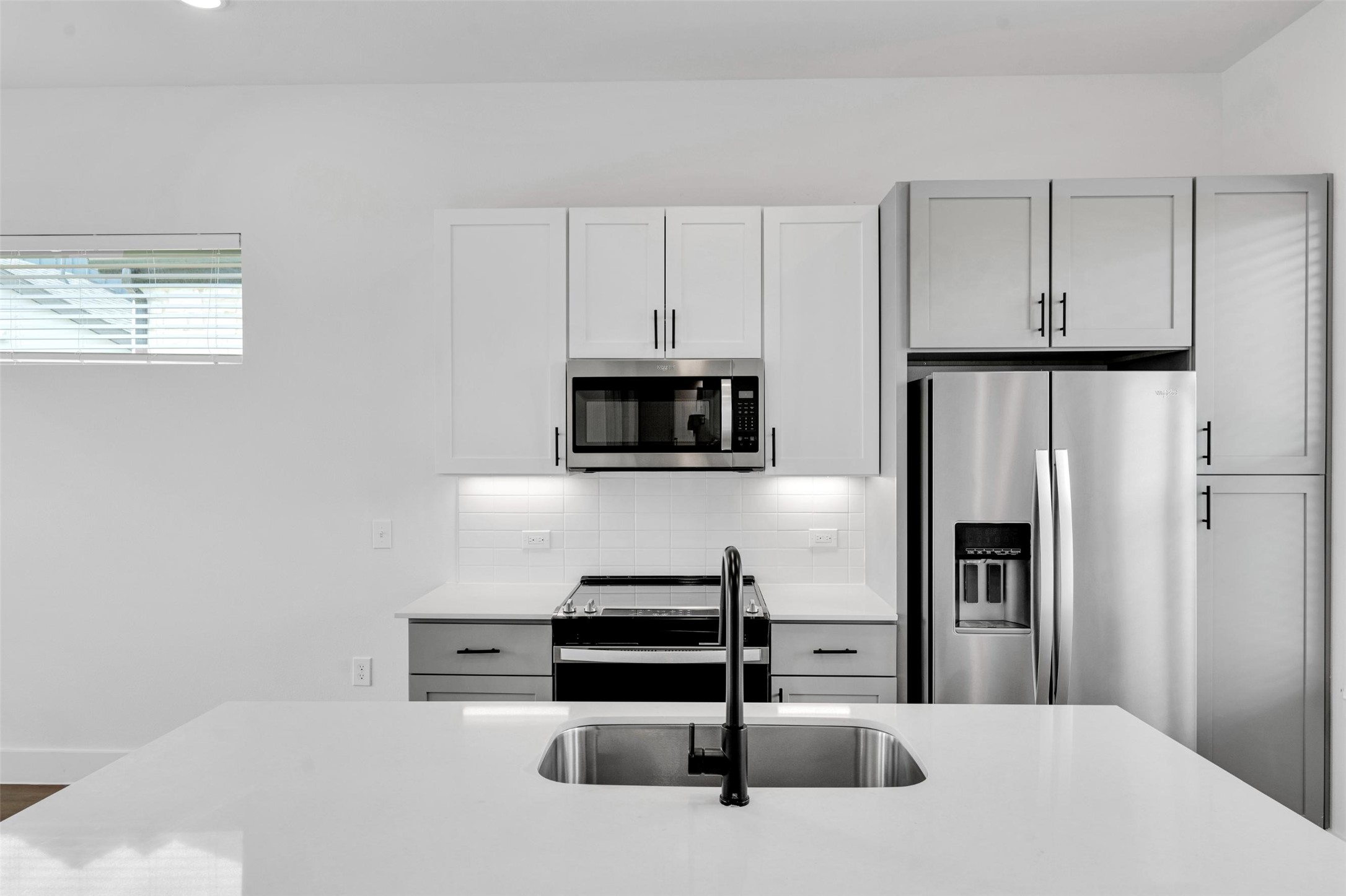 1488 Bernard Street Rowlett, TX 75089 - Photo 5 of 27 a kitchen with stainless steel appliances a refrigerator and a stove