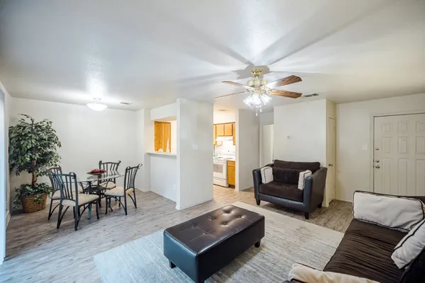 a view of a dining room with furniture and wooden floor