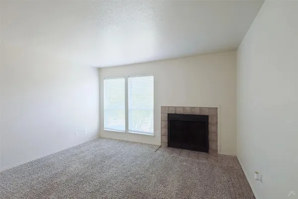 a utility room with cabinets washer and dryer