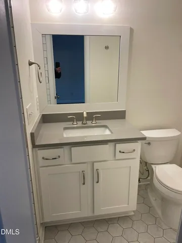 a bathroom with a sink and mirror