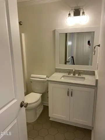 a view of a house with a yard and wooden fence