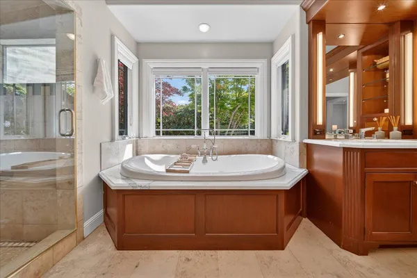 a bathroom with shower a window and a couch