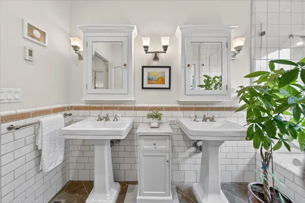 a spacious bathroom with a sink and a mirror