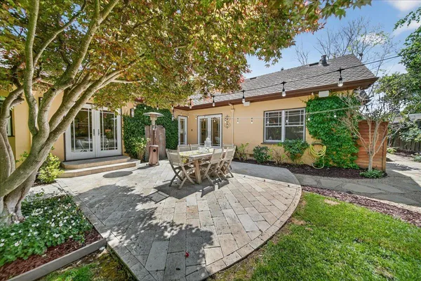 a view of a backyard with sitting area