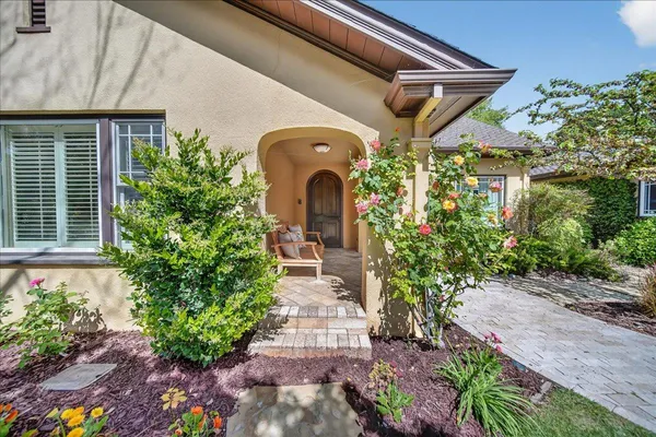 a front view of a house with garden