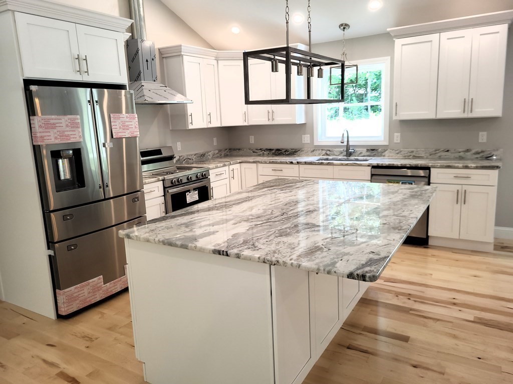 17 Harwood Farm Road Southbridge, MA 01550 - Photo 2 of 23 a kitchen with stainless steel appliances granite countertop a refrigerator a stove a sink and a microwave