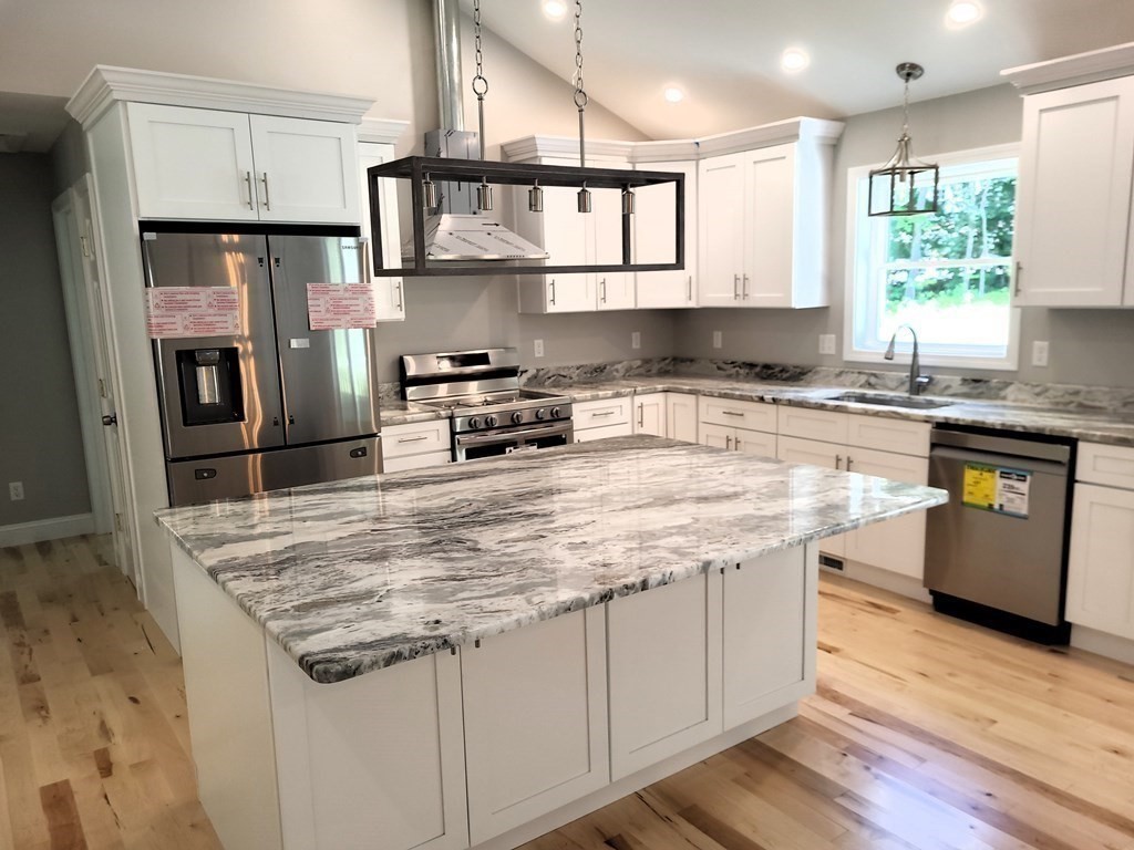 17 Harwood Farm Road Southbridge, MA 01550 - Photo 3 of 23 a kitchen with stainless steel appliances granite countertop a sink stove and refrigerator